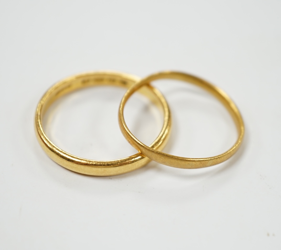Two 22ct gold wedding bands, 4.3 grams. Condition - fair
